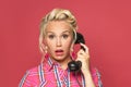 Surprised pinup woman phone on red background Royalty Free Stock Photo