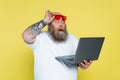 surprised plus size man holding red Royalty Free Stock Photo