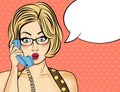 Surprised pop art woman chatting on retro phone . Comic woman w Royalty Free Stock Photo