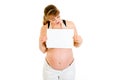 Surprised pregnant woman looking on white paper