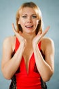 Surprised pretty woman in red dress Royalty Free Stock Photo