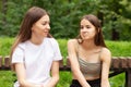 Surprised puzzled girl learned the news from her friend, real emotions