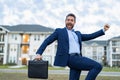 surprised real estate business man with briefcase. real estate business man outdoor.