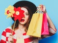 Woman with pinwheel and shopping bags Royalty Free Stock Photo