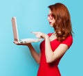 Surprised redhead girl with laptop Royalty Free Stock Photo