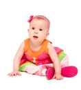 Surprised, sad little baby girl in bright multicolored festive d Royalty Free Stock Photo