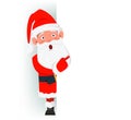 Surprised Santa Claus standing behind a sign and showing on blank placard