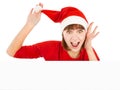 Surprised Santa woman peeking from blank billboard Royalty Free Stock Photo