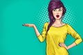 Surprised woman is showing. Advertising design of amazed party girl presenting something in pop art style. Royalty Free Stock Photo