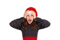Surprised shocked beautiful woman in dress looking at the camera. emotional girl in santa claus christmas hat isolated on white ba Royalty Free Stock Photo