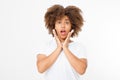 Surprised shocked excited african american woman face isolated on white background. Young afro curly hair style girl in t shirt