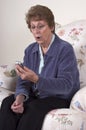 Surprised Shocked Grandma Texting on Cell Phone Royalty Free Stock Photo