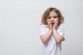 Surprised smiling little girl in white shirt Royalty Free Stock Photo