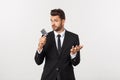 Surprised, speechless and impressed handsome caucasian businessman in classic suit showing credit card, say wow Royalty Free Stock Photo