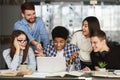 Surprised students finding out test results on laptop Royalty Free Stock Photo