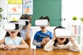 Surprised students with virtual reality headset Royalty Free Stock Photo