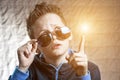 Surprised boy in blue sunscreen who got the idea Royalty Free Stock Photo