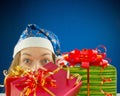 Surprised teen girl with Christmas presents Royalty Free Stock Photo