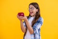 surprised teen girl eating healthy food. teen kid girl holding apple. healthy food. Fresh apple for teen girl. Healthy Royalty Free Stock Photo