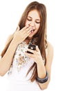 Surprised teen girl looking at the mobile phone Royalty Free Stock Photo