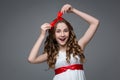 Surprised teen girl with red bow on head Royalty Free Stock Photo