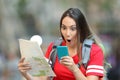 Surprised teen tourist reading online content