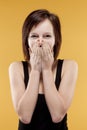 Surprised teenage girl covering mouth Royalty Free Stock Photo