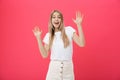 Surprised teenage student girl show shocking expression with something. on Bright Pink Background. Copy space Royalty Free Stock Photo