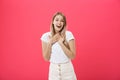 Surprised teenage student girl show shocking expression with something. on Bright Pink Background. Copy space Royalty Free Stock Photo