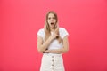 Surprised teenage student girl show shocking expression with something. Isolated on Bright Pink Background. Copy space Royalty Free Stock Photo