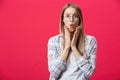 Surprised teenage student girl show shocking expression with something. Isolated on Bright Pink Background. Copy space Royalty Free Stock Photo