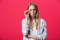 Surprised teenage student girl show shocking expression with something. Isolated on Bright Pink Background. Copy space Royalty Free Stock Photo