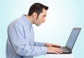 Surprised while using his laptop Royalty Free Stock Photo
