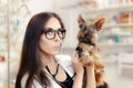 Surprised Veterinarian Female Doctor with Cute Dog Royalty Free Stock Photo