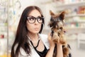 Surprised Veterinarian Female Doctor with Cute Dog Royalty Free Stock Photo