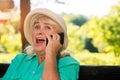 Surprised woman with cell phone. Royalty Free Stock Photo