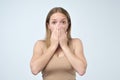 Surprised woman covering with hands her mouth Royalty Free Stock Photo