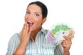 Surprised woman with handful of money