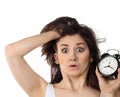 Surprised woman holding clock Royalty Free Stock Photo