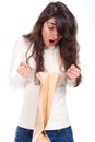 Surprised woman holding a shopping bag and looking ins Royalty Free Stock Photo