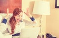 Surprised woman with laptop computer in her hotel room Royalty Free Stock Photo