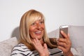 Surprised Woman Looking at her Phone Royalty Free Stock Photo