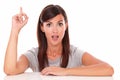 Surprised woman pointing up her finger Royalty Free Stock Photo