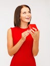 Surprised woman in red dress with gift box Royalty Free Stock Photo