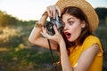 Surprised woman taking nature snapshot lifestyle hobby