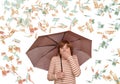 Surprised woman with umbrella and euro banknotes falling down Royalty Free Stock Photo