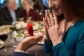 Surprised woman and unrecognizable man with ring in red box Christmas proposal