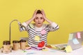 Surprised woman worker covered with sticky notes looking at camera with big eyes and open mouth. Royalty Free Stock Photo