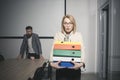 Surprised woman and bearded man on background. Business woman in glasses hold file folders. secretary with office Royalty Free Stock Photo