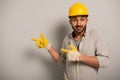 Workman in helmet and safety gloves